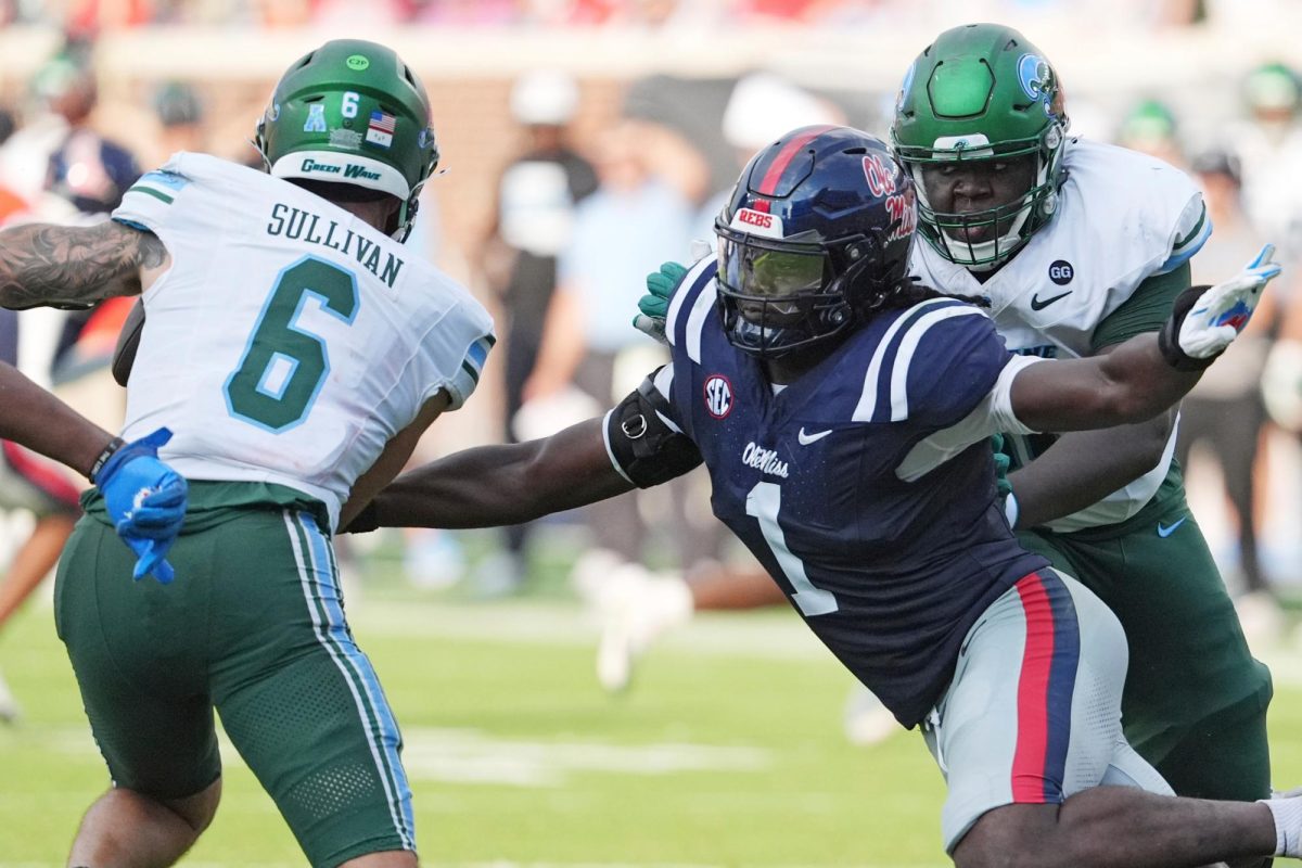 Mississippi defensive end Princewill Umanmielen (1) attempts to sack Tulane quarterback Brendan Sullivan (6) during the second half of an NCAA college football game in Oxford, Miss., Saturday, Sept. 20, 2025. (AP Photo/Rogelio V. Solis)